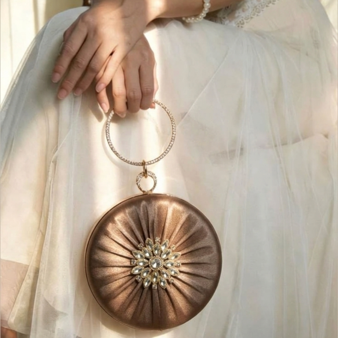 The Bronze Aura Ring Handle Clutch